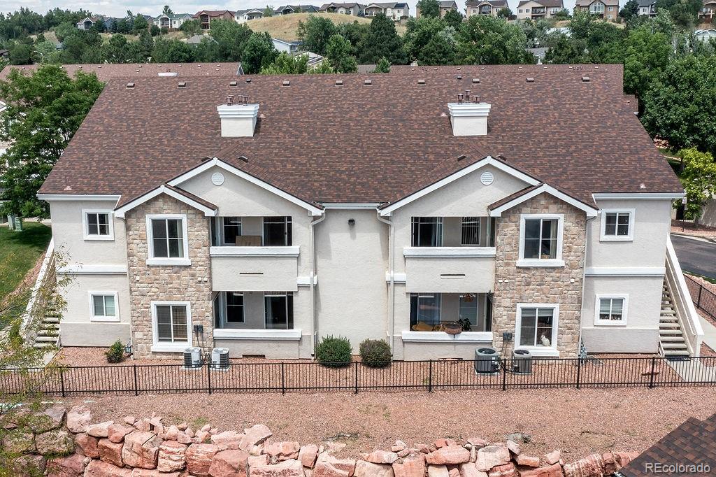 3875 Strawberry Field Grove Colorado Springs, CO 80906 - Photo 16 of 50 a aerial view of a house with yard