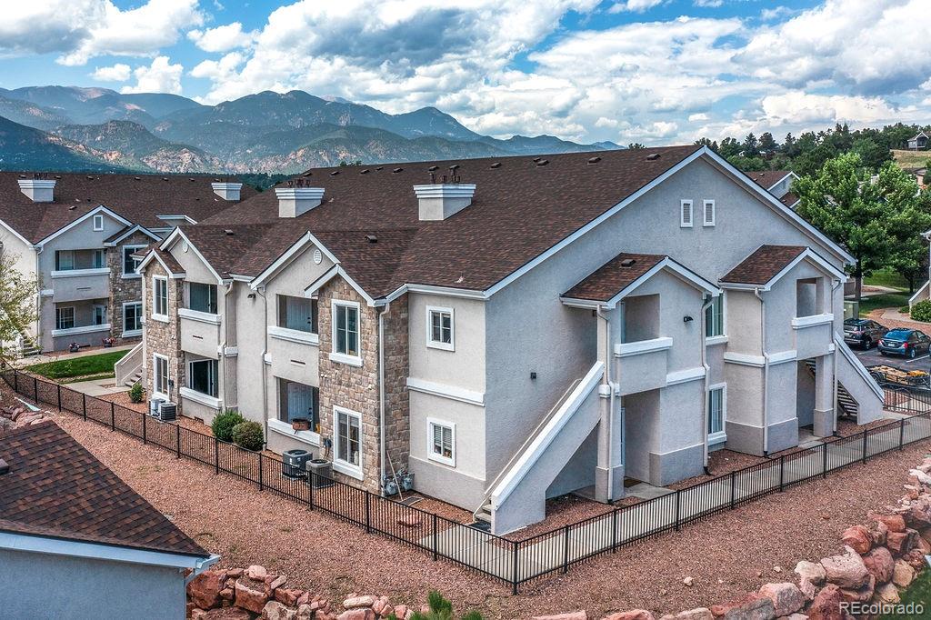 3875 Strawberry Field Grove Colorado Springs, CO 80906 - Photo 20 of 50 a aerial view of a house with a big yard