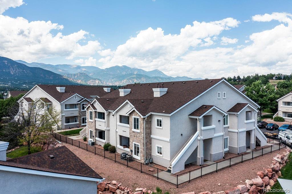 3875 Strawberry Field Grove Colorado Springs, CO 80906 - Photo 21 of 50 a front view of a house with a yard