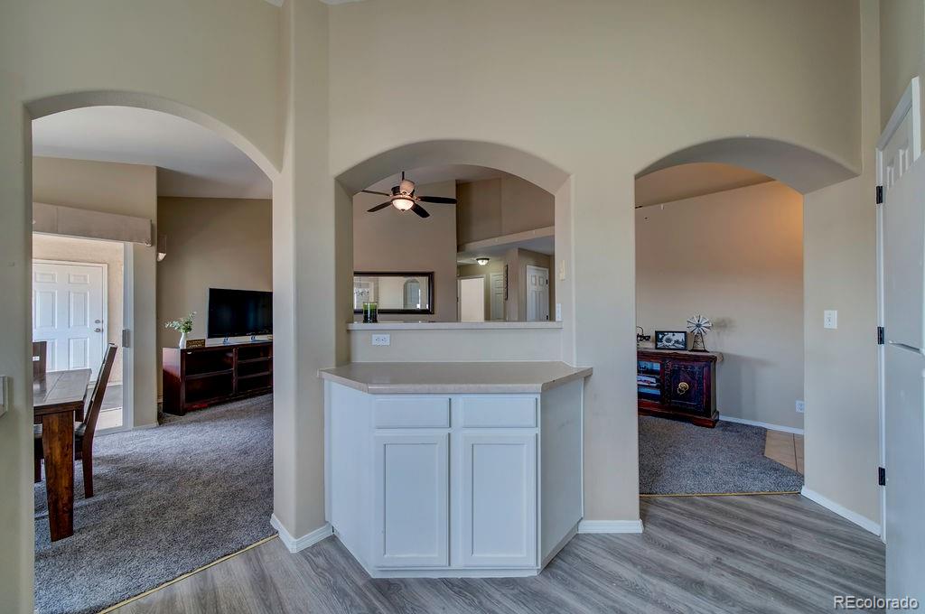3875 Strawberry Field Grove Colorado Springs, CO 80906 - Photo 38 of 50 a living room with furniture and a wooden floor