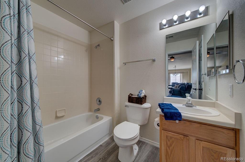3875 Strawberry Field Grove Colorado Springs, CO 80906 - Photo 45 of 50 a bathroom with a sink toilet tub and shower