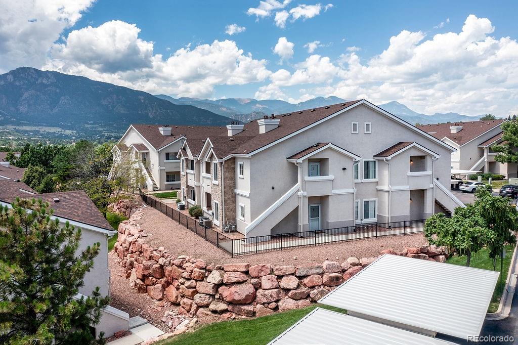 3875 Strawberry Field Grove Colorado Springs, CO 80906 - Photo 5 of 50 a front view of a house with a yard