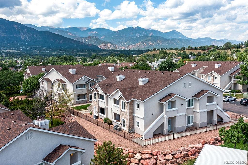 3875 Strawberry Field Grove Colorado Springs, CO 80906 - Photo 7 of 50 an aerial view of residential houses with a city view