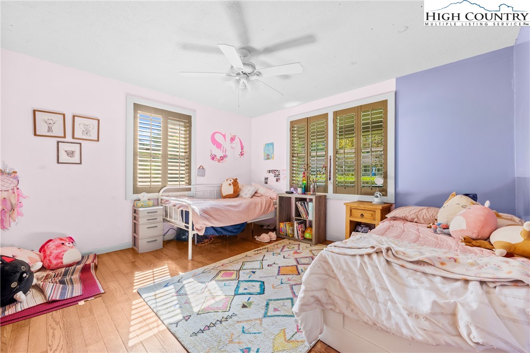 239 Deerfield Estates Road Boone, NC 28607 - Photo 21 of 45 a bedroom with furniture and a window