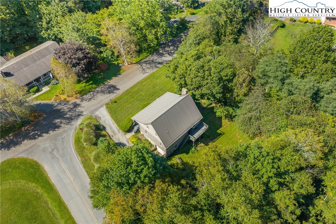 239 Deerfield Estates Road Boone, NC 28607 - Photo 42 of 45 an aerial view of a house with a yard and trees