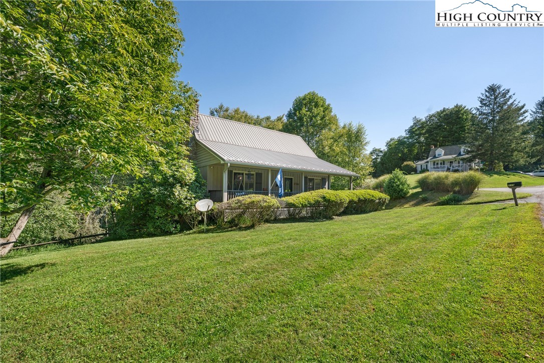 239 Deerfield Estates Road Boone, NC 28607 - Photo 43 of 45 a front view of a house with a yard