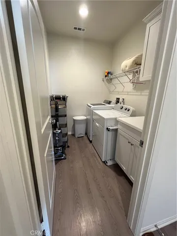 a room with sink a washer and dryer