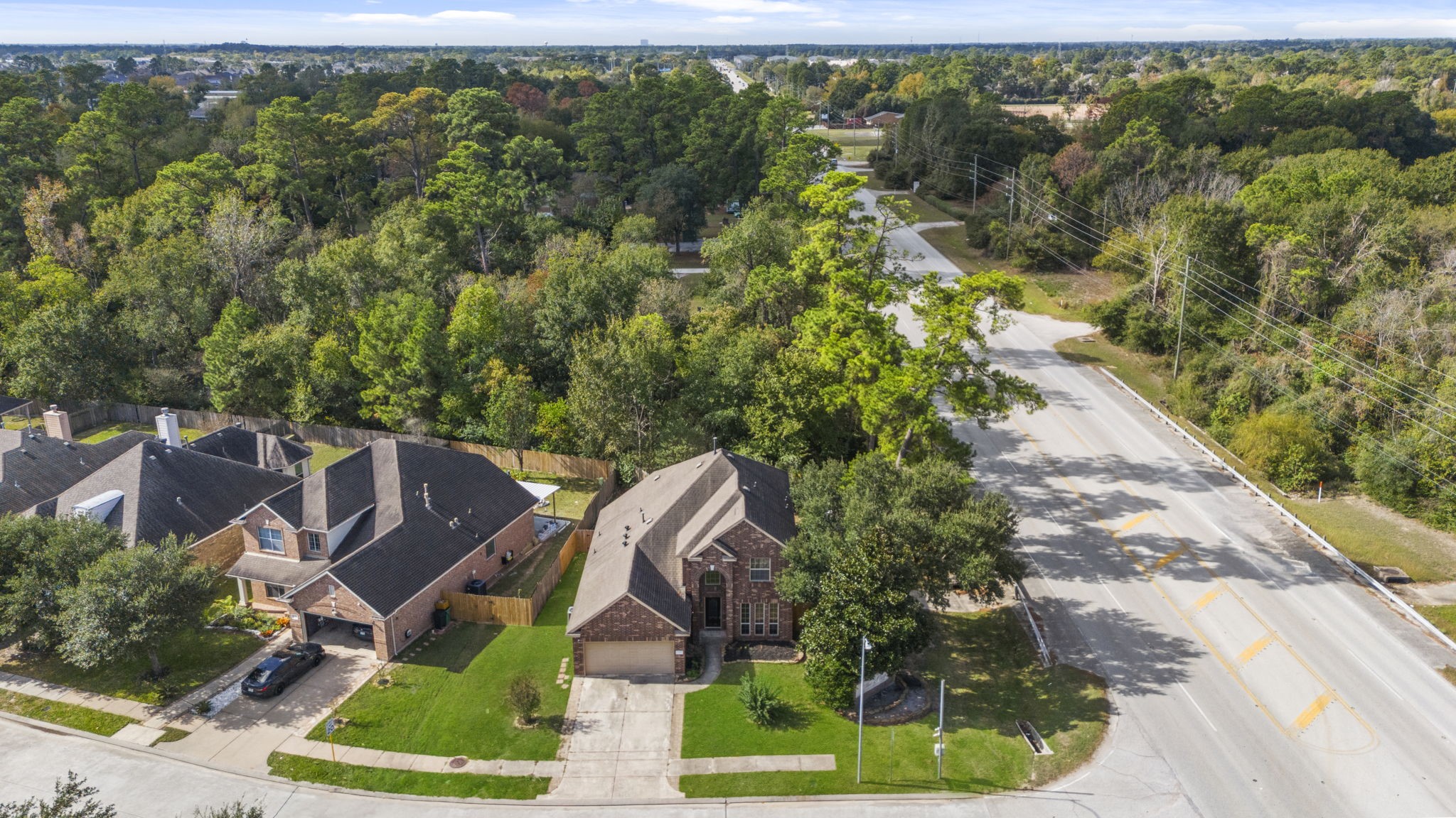 20555 Bonds Creek Lane Spring, TX 77388 - Photo 31 of 34 an aerial view of a house with garden space and street view