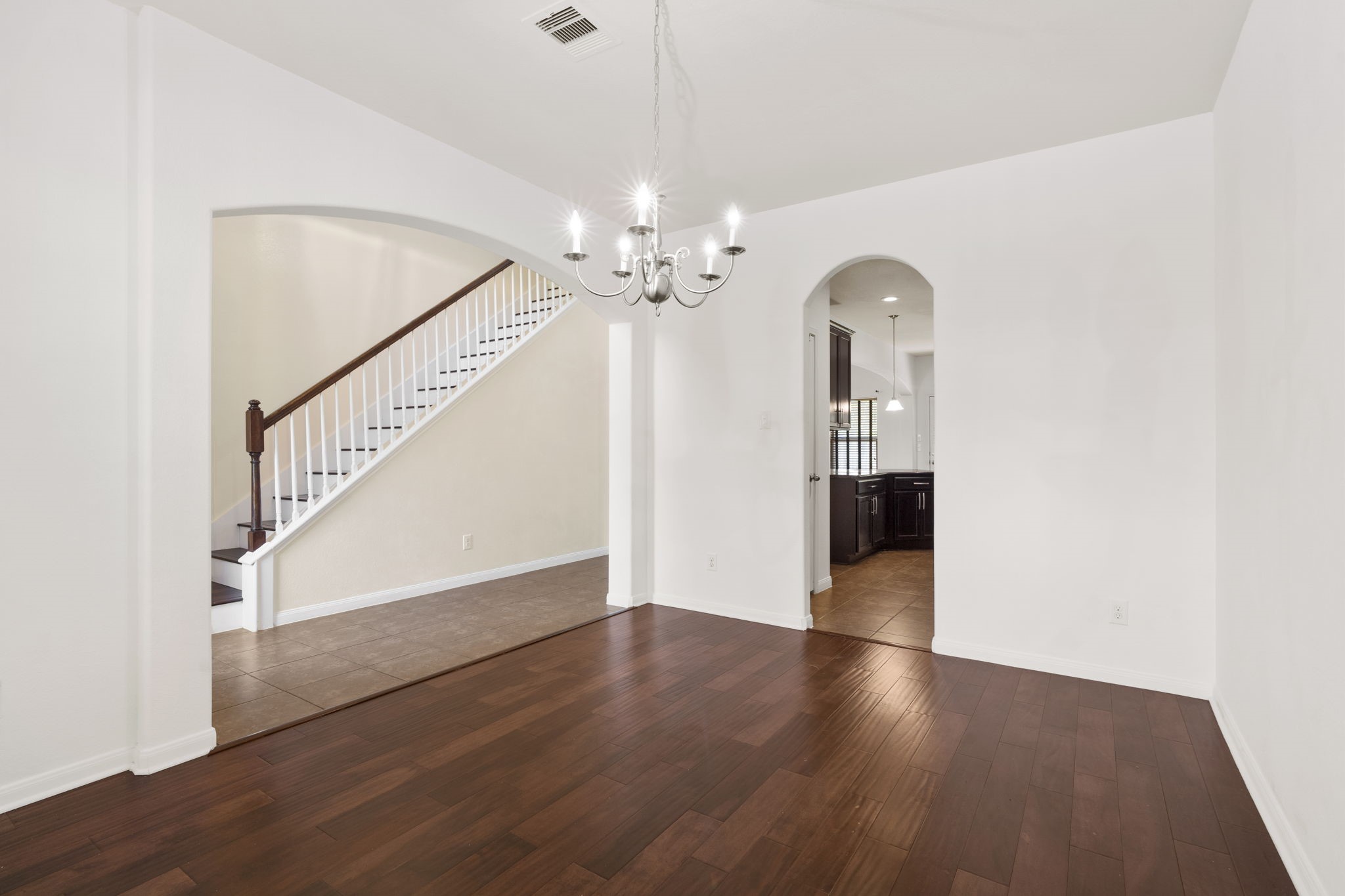 20555 Bonds Creek Lane Spring, TX 77388 - Photo 6 of 34 a view of a livingroom with wooden floor and staircase