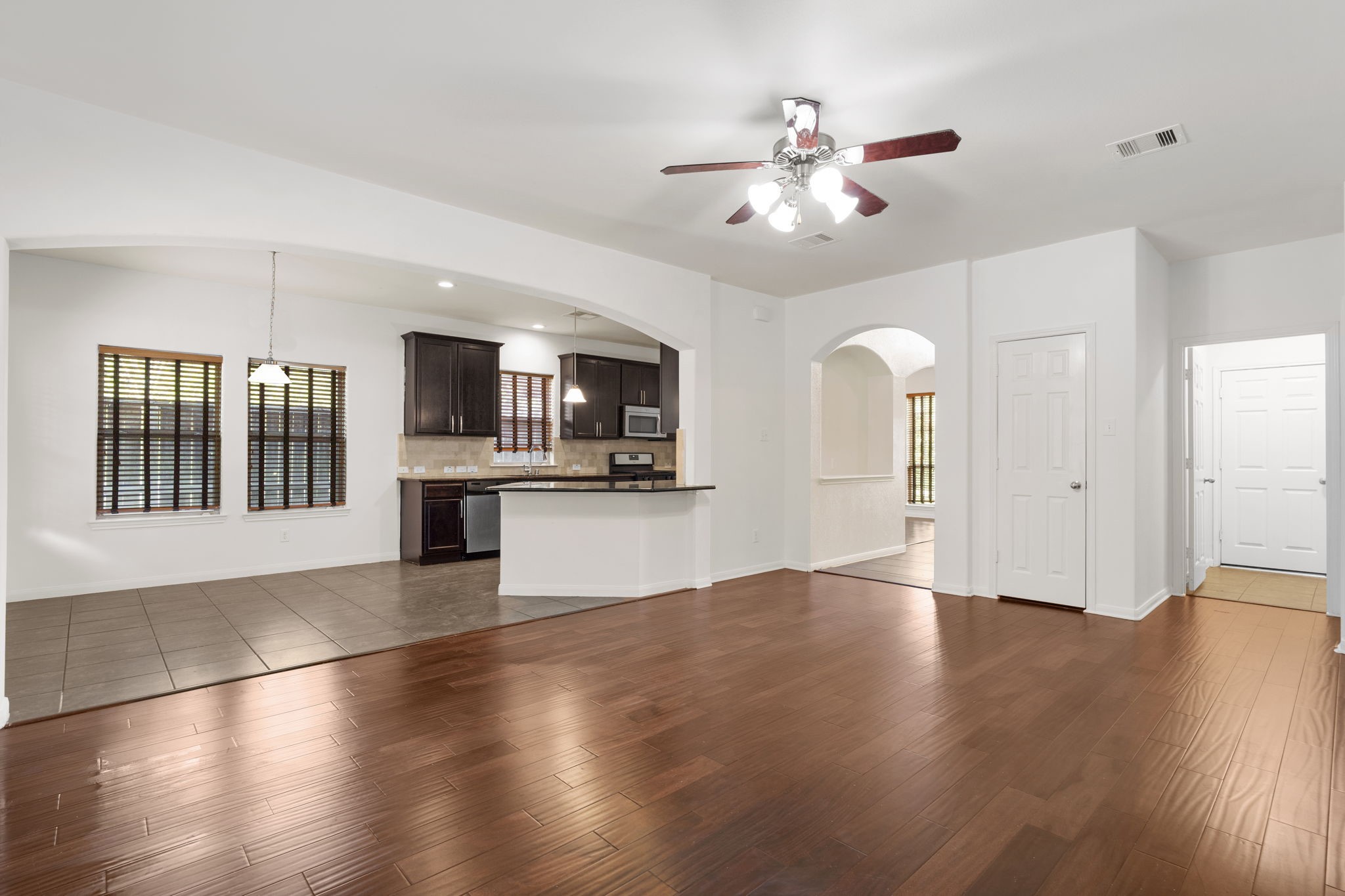 20555 Bonds Creek Lane Spring, TX 77388 - Photo 8 of 34 a view of an empty room with kitchen and window