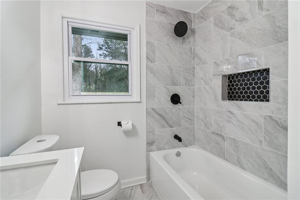 3159 Bobolink Drive Decatur, GA 30032 - Photo 14 of 37 a bathroom with a toilet and a shower