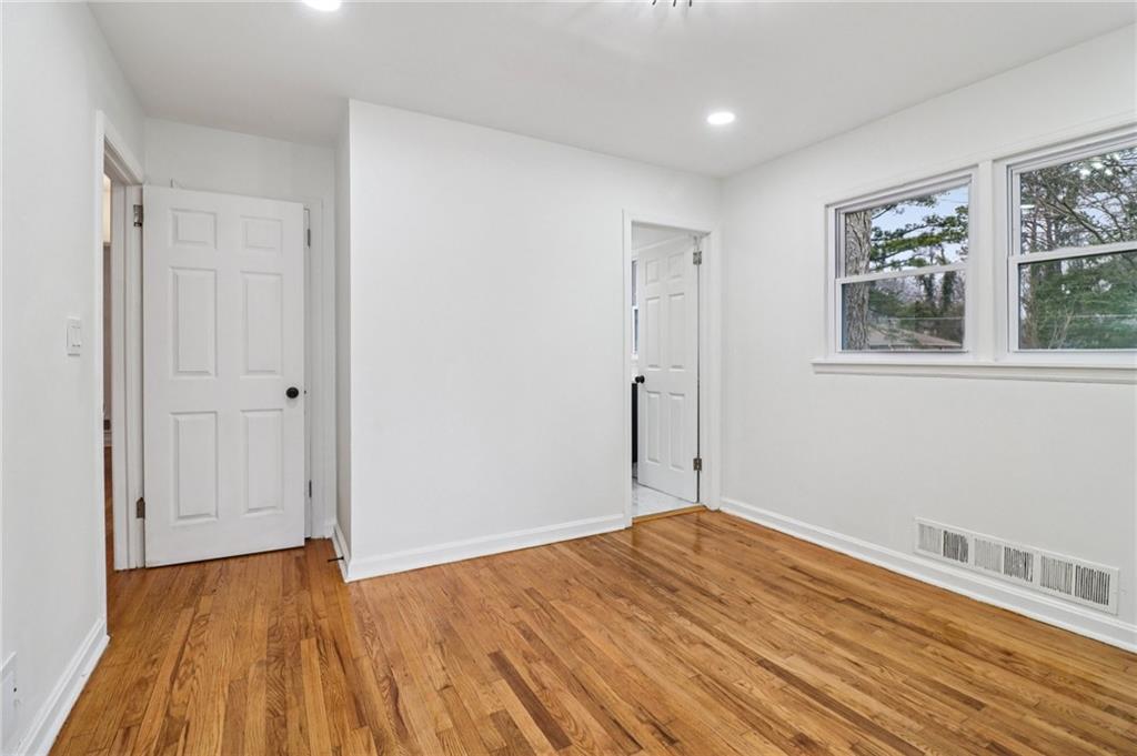 3159 Bobolink Drive Decatur, GA 30032 - Photo 21 of 37 a view of empty room with wooden floor and fan