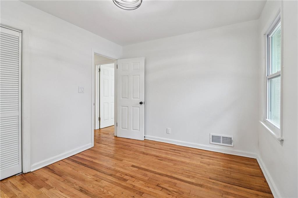 3159 Bobolink Drive Decatur, GA 30032 - Photo 24 of 37 a view of an empty room with wooden floor and a window