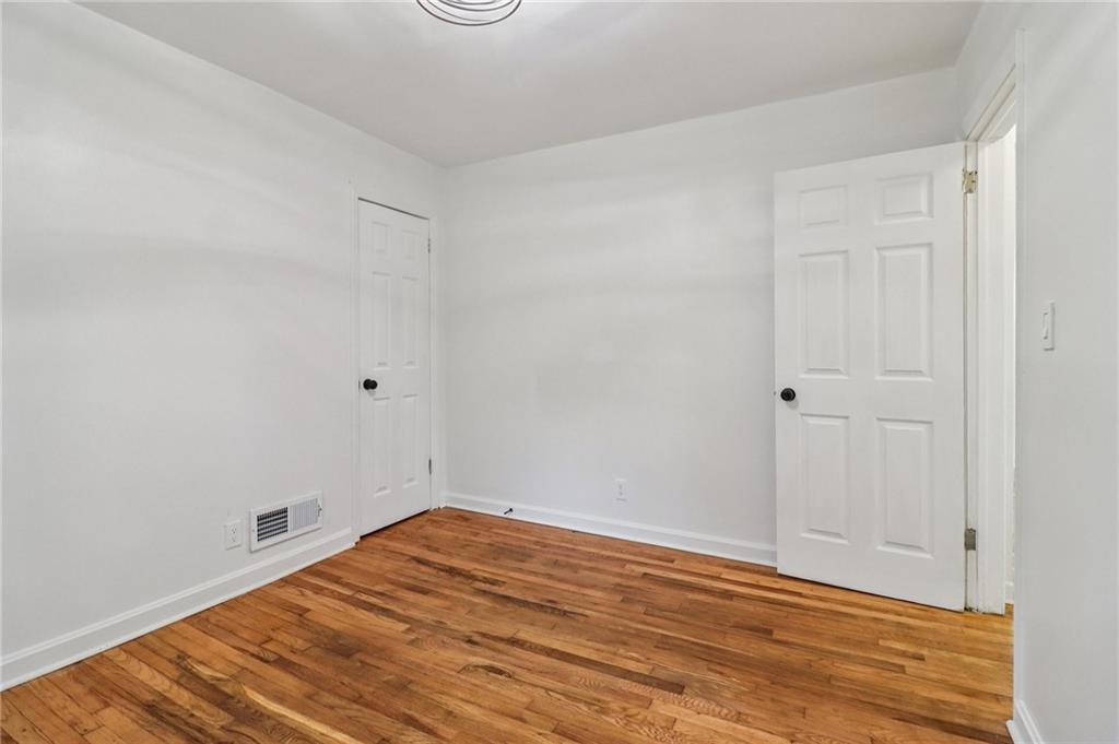 3159 Bobolink Drive Decatur, GA 30032 - Photo 27 of 37 a view of empty room with wooden floor