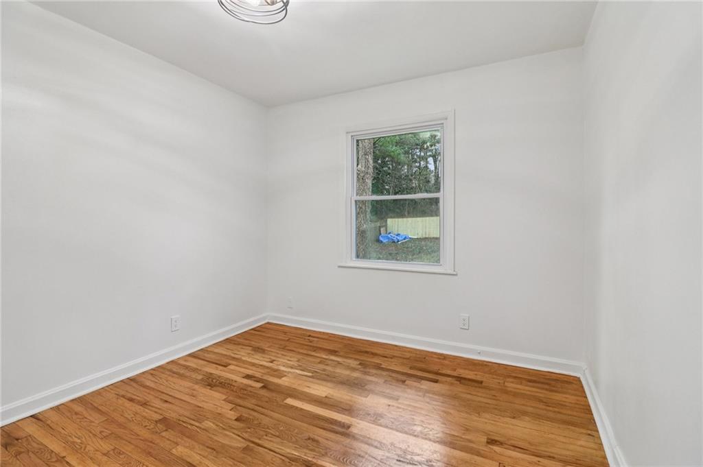3159 Bobolink Drive Decatur, GA 30032 - Photo 29 of 37 a view of empty room with wooden floor and fan