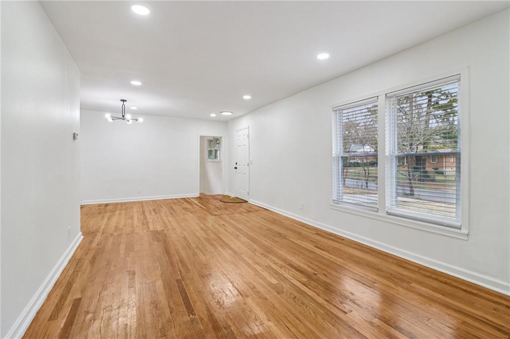 3159 Bobolink Drive Decatur, GA 30032 - Photo 32 of 37 a view of an empty room with wooden floor and a window