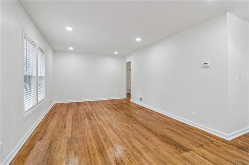 3159 Bobolink Drive Decatur, GA 30032 - Photo 34 of 37 a view of empty room with wooden floor and fan