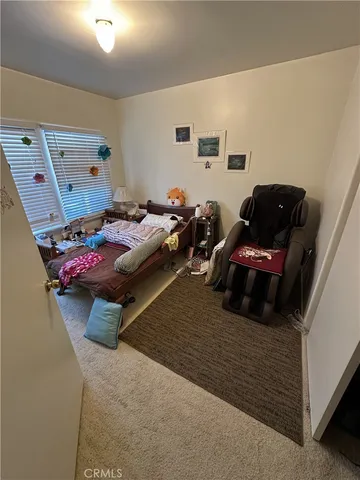 a bedroom with furniture and a bed