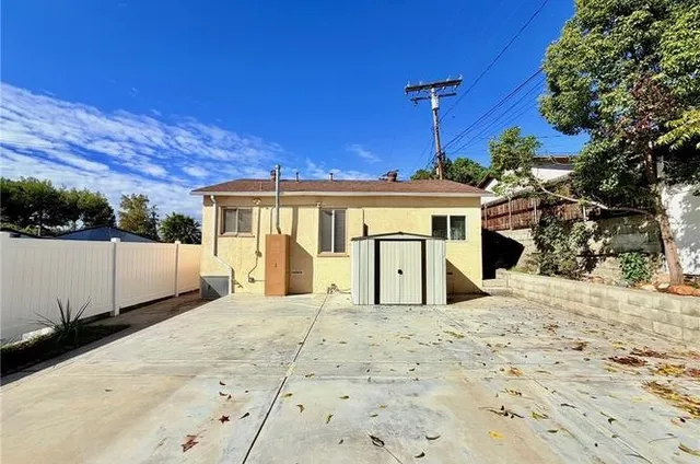 a view of a house with a snow in the yard