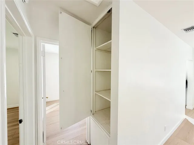 a bathroom with a walk in closet and a bathroom