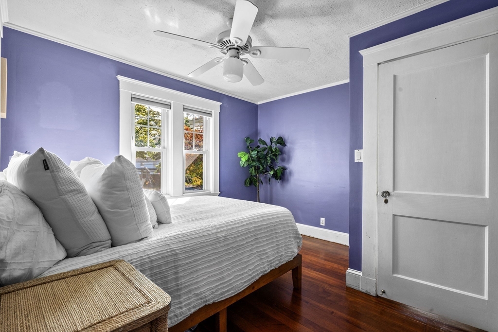 92 Old Connecticut Path Framingham, MA 01701 - Photo 11 of 24 a bedroom with a bed and wooden floor
