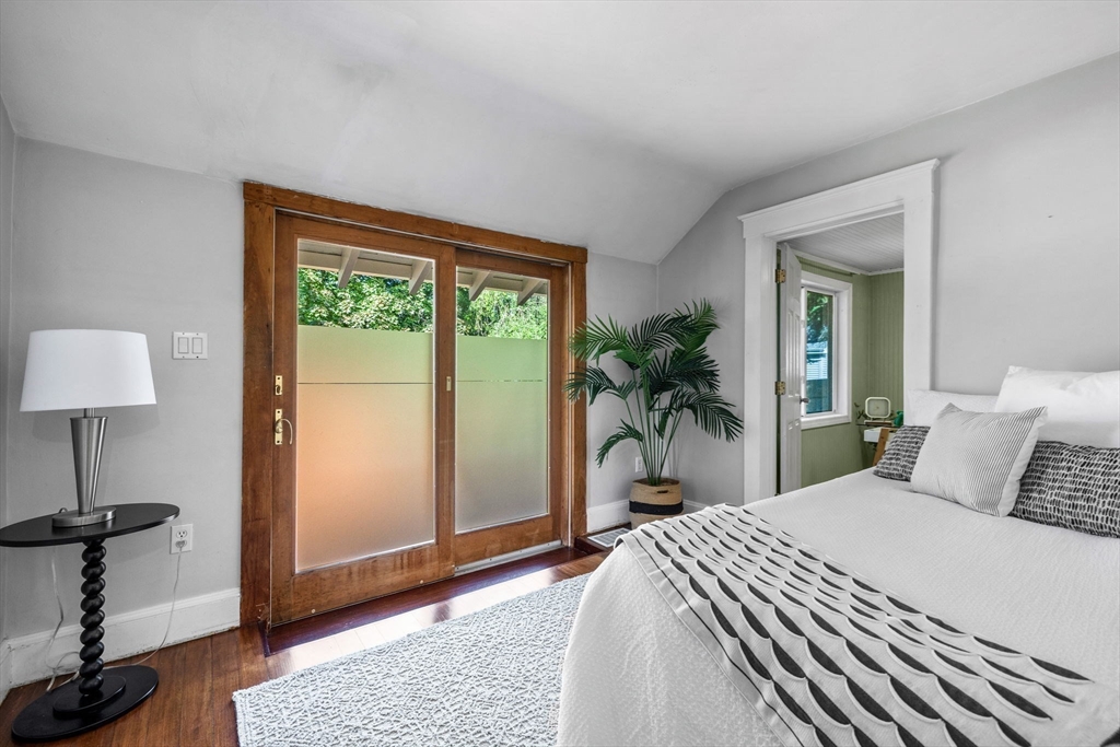 92 Old Connecticut Path Framingham, MA 01701 - Photo 14 of 24 a bedroom with a large bed and a potted plant