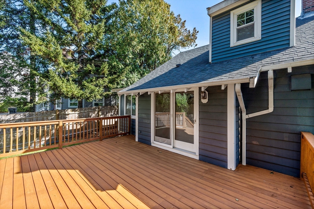 92 Old Connecticut Path Framingham, MA 01701 - Photo 18 of 24 a view of a wooden deck and a yard