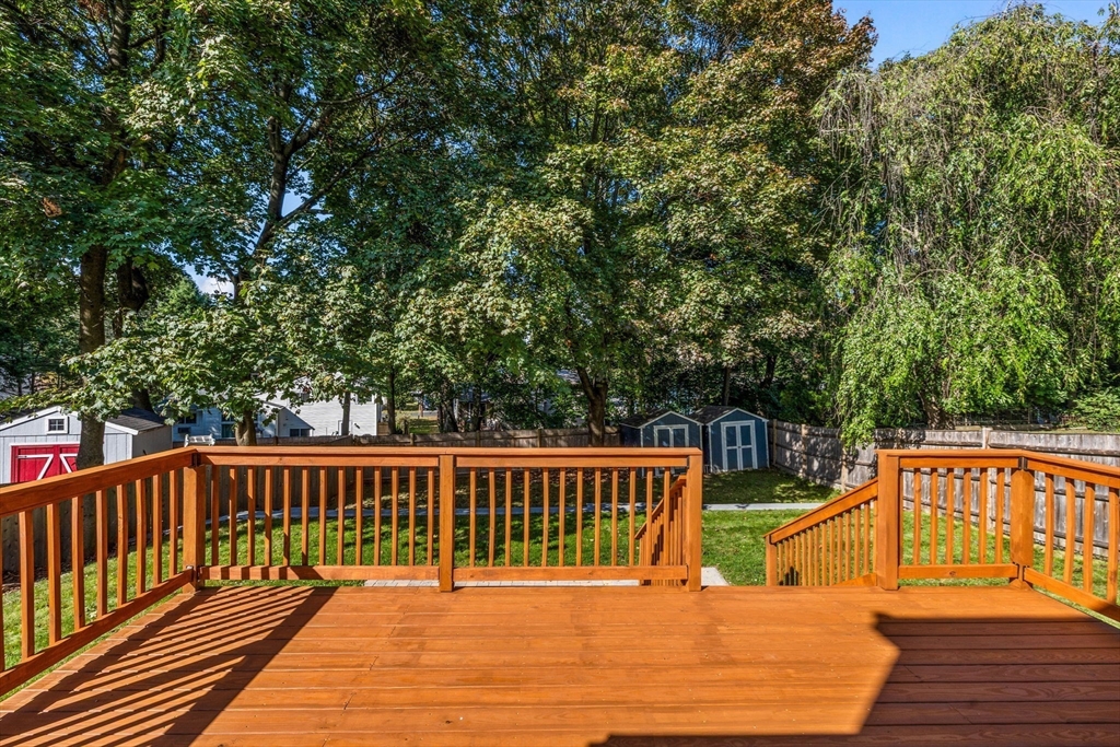 92 Old Connecticut Path Framingham, MA 01701 - Photo 19 of 24 a roof deck with wooden floor and fence