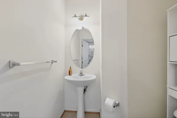 a bathroom with a sink and mirror