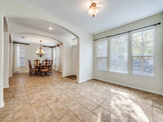 a view of livingroom with furniture and chandelier fan