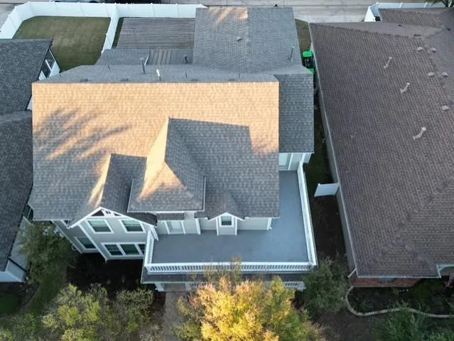 an aerial view of residential houses with outdoor space
