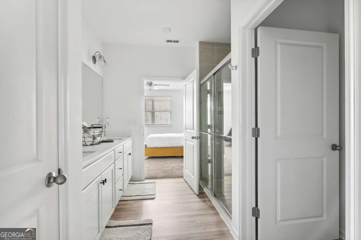 1449 Proust Lane, Unit 1449 Stockbridge, GA 30281 - Photo 14 of 19 a bathroom with a tub and shower