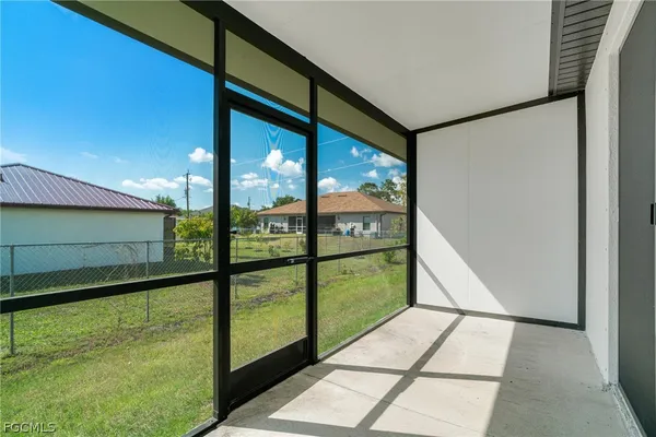 a kitchen with a stove a sink and dishwasher with white cabinets