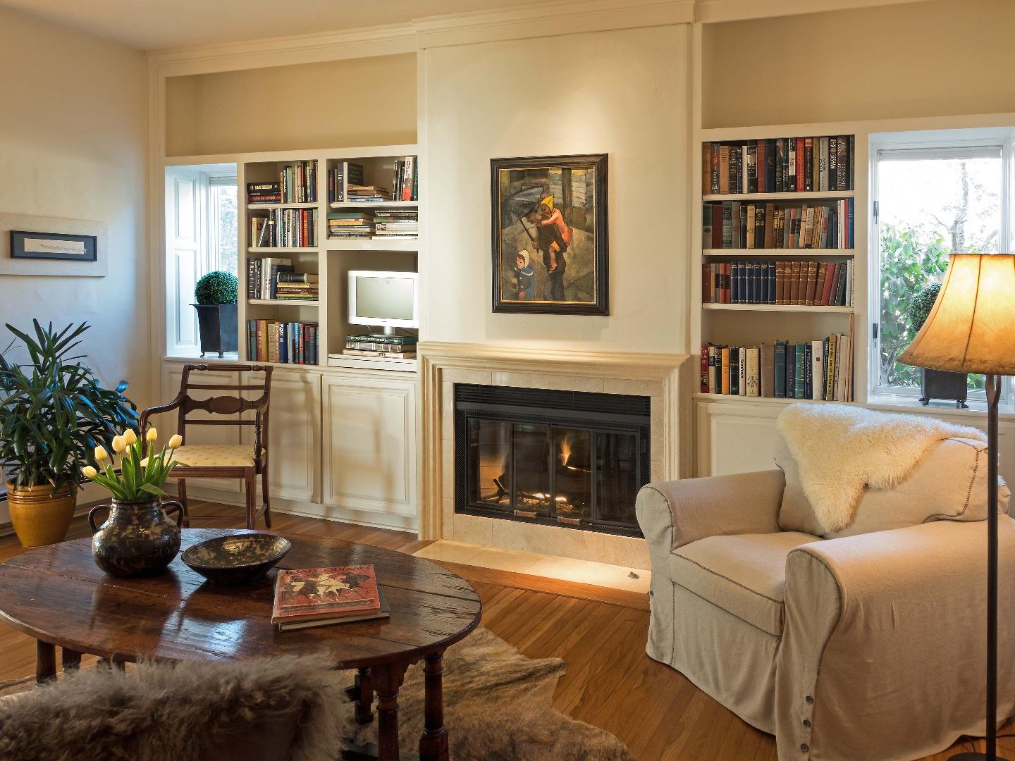 1000 Rodeo Road Pebble Beach, CA 93953 - Photo 11 of 28 a living room with furniture and a fireplace