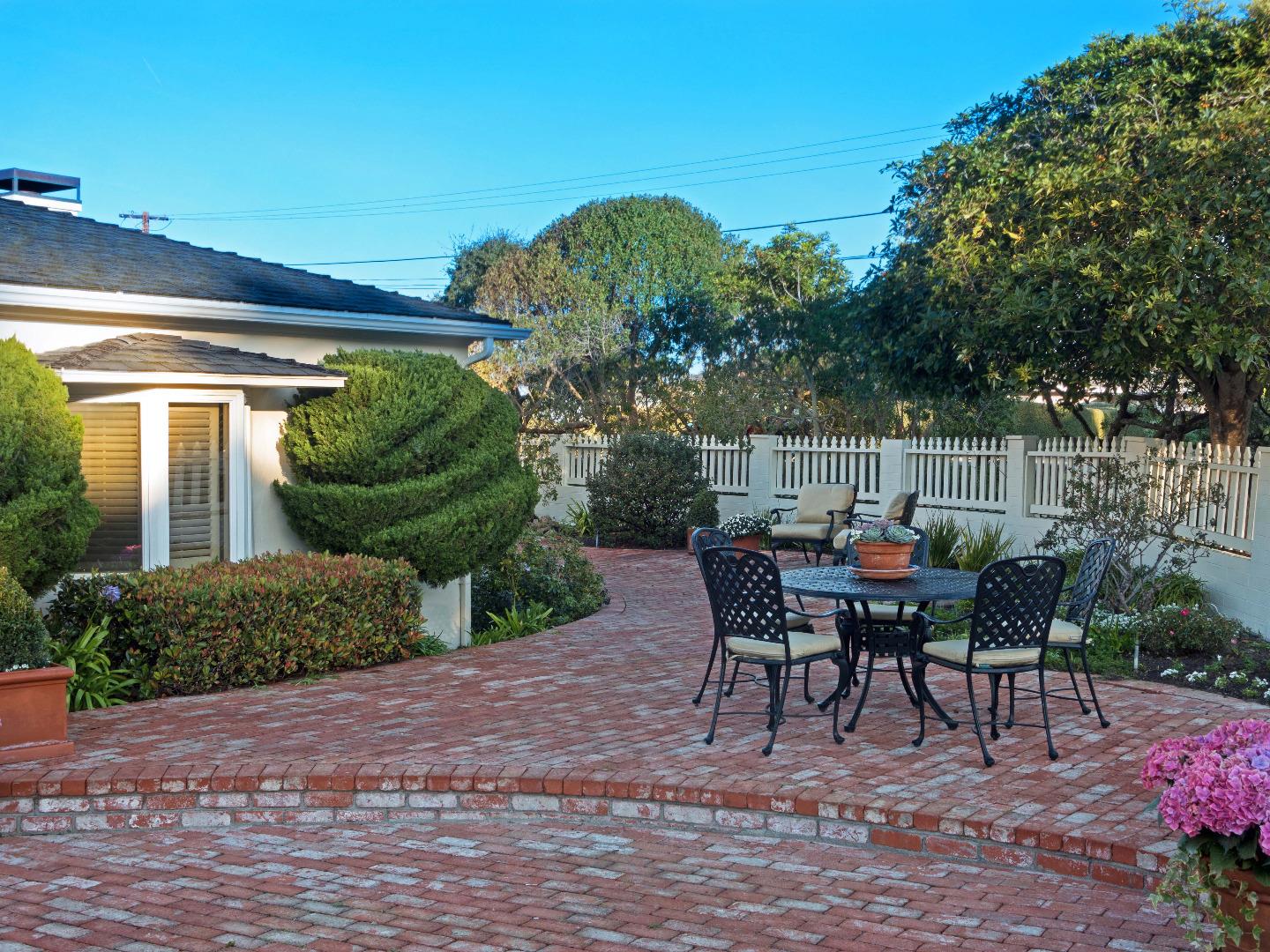 1000 Rodeo Road Pebble Beach, CA 93953 - Photo 26 of 28 a view of a tables and chairs in patio