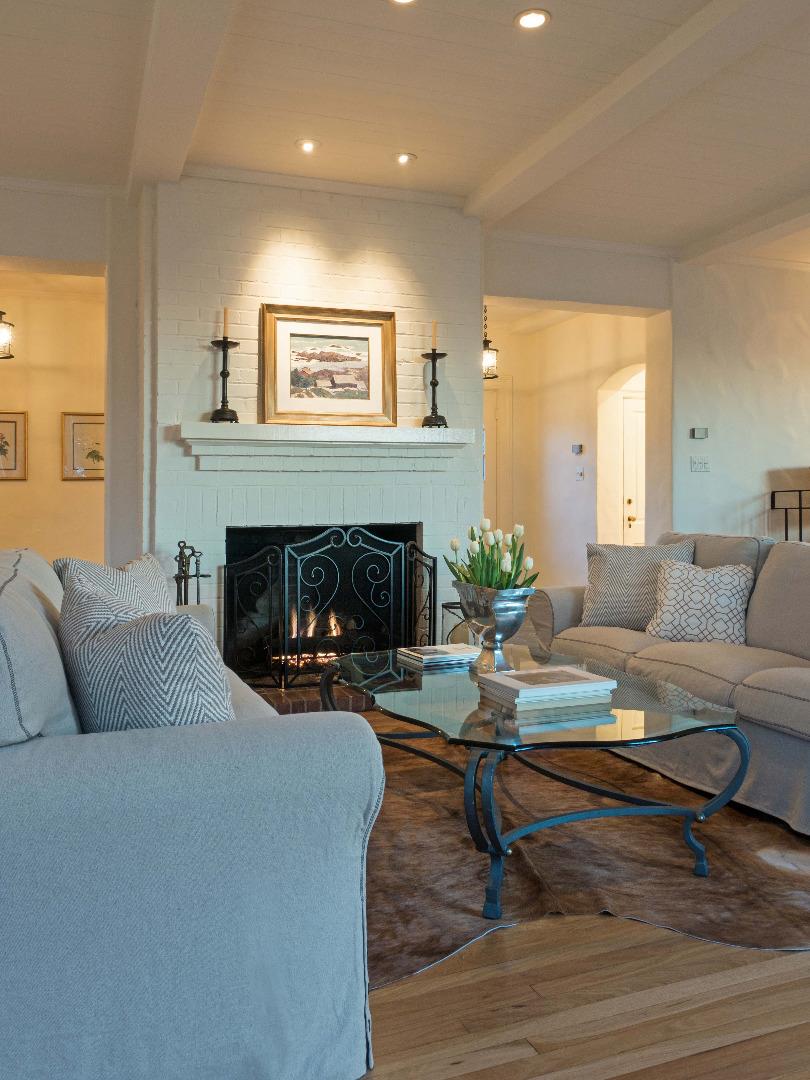 1000 Rodeo Road Pebble Beach, CA 93953 - Photo 4 of 28 a living room with furniture and a fireplace