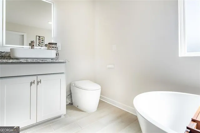 a bathroom with a toilet and a sink