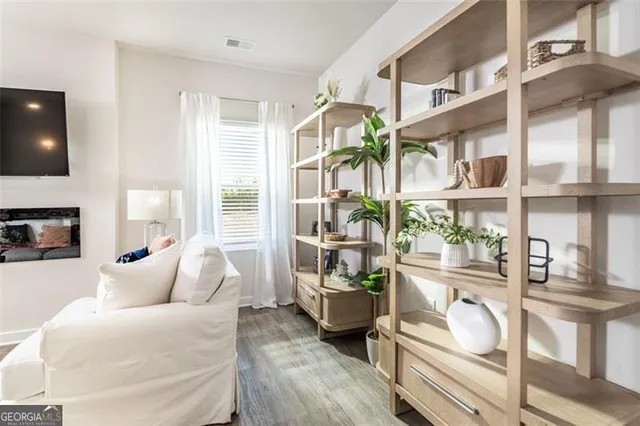 a living room with furniture and a window