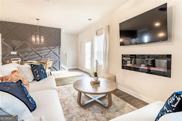 a living room with furniture and a flat screen tv