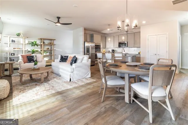 a view of a dining room with furniture window and wooden floor