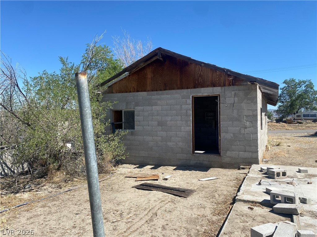 701 3rd Street Gabbs, NV 89409 - Photo 6 of 10 A partially completed structure featuring block construction and an open doorway.