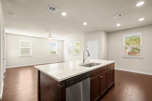 a view of an house with backyard and kitchen