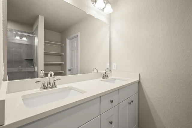 a kitchen with a sink and a stove top oven