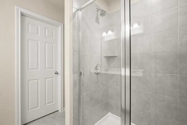 a kitchen with a sink a window and wooden floor