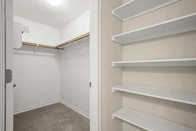 a view of an empty room with windows