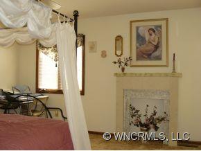 764 Oscar Chappell Road Brevard, NC 28712 - Photo 12 of 21 a view of a hallway with paintings on the wall