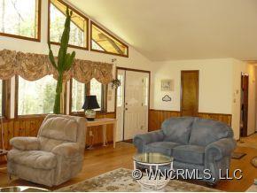 764 Oscar Chappell Road Brevard, NC 28712 - Photo 6 of 21 a living room with furniture and a large window