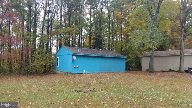 a house that has a tree in front of it
