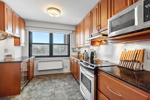 a kitchen that has a sink and a stove