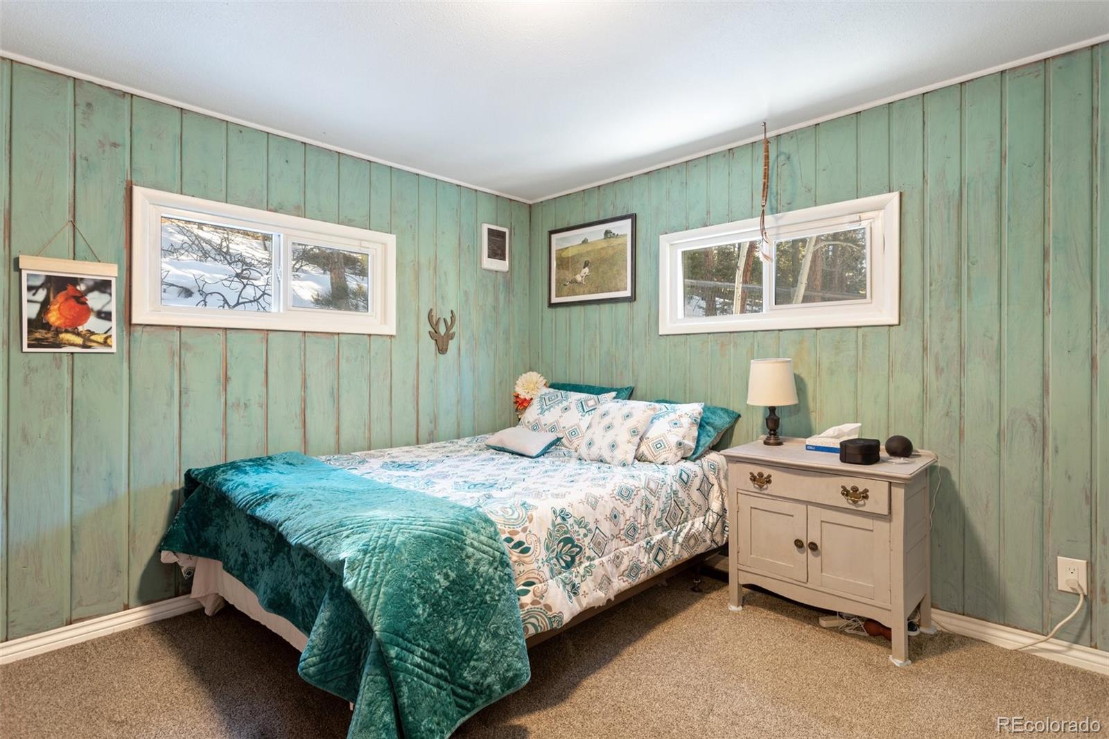 6230 Waterfall Loop Manitou Springs, CO 80829 - Photo 14 of 23 a bedroom with a bed and a window